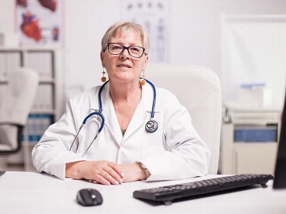 Older female doctor in clinic