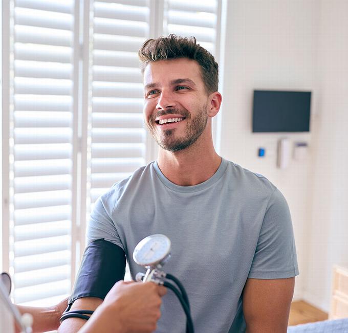 man having health check at clinc