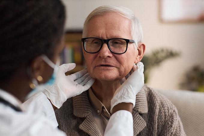 older man having health check
